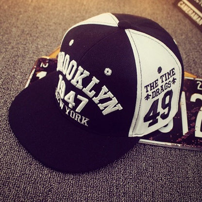 Flat-brim acrylic snapback front logo close-up