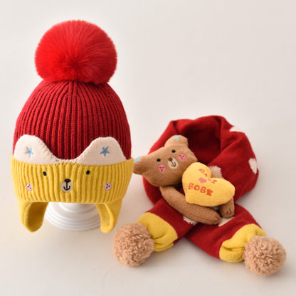 Red and yellow winter hat and scarf set arranged together