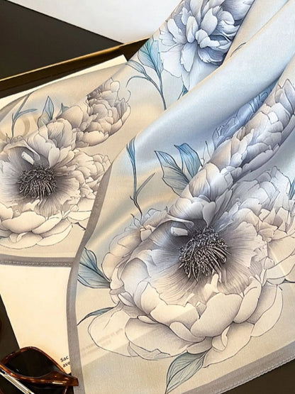 Unisex Floral Print Silk Square Scarf — folded scarf showing floral illustration and pale border
