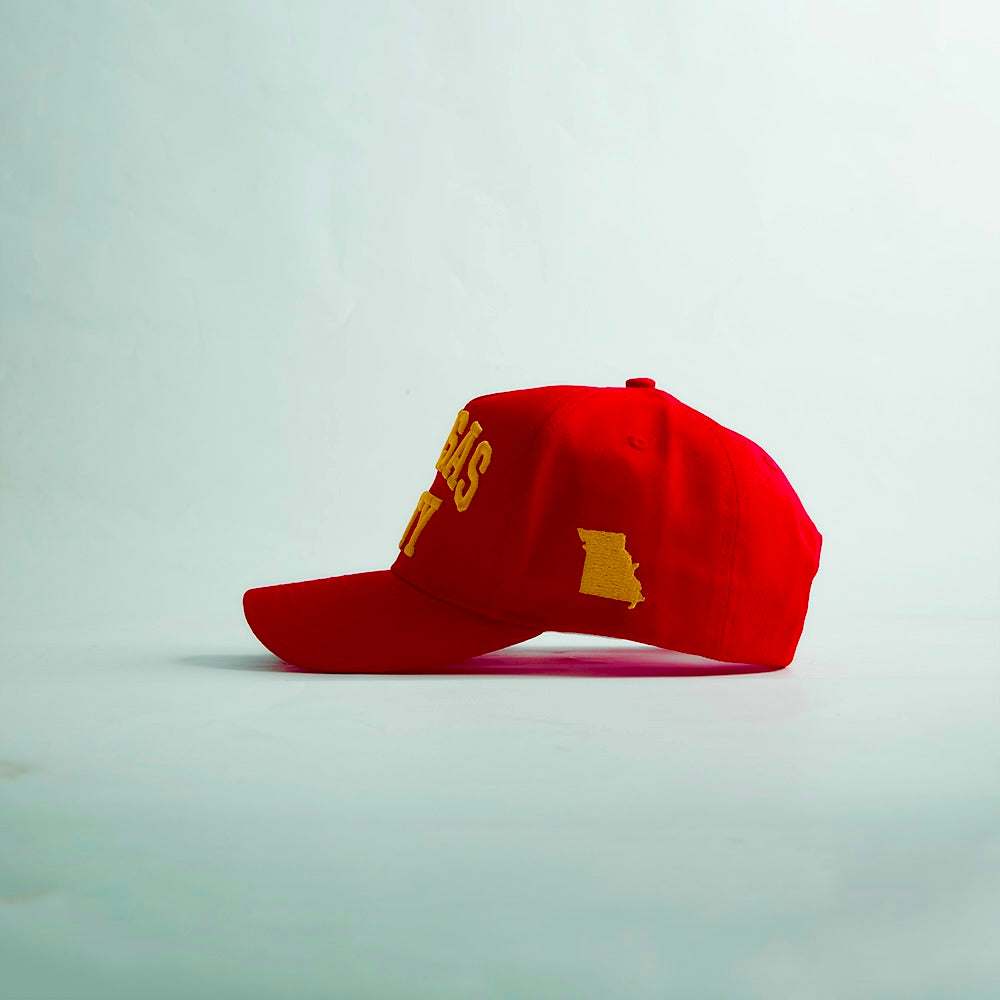 Side profile of the Destination Hat Co. Kansas City Legacy snapback showing the curved bill and side logo