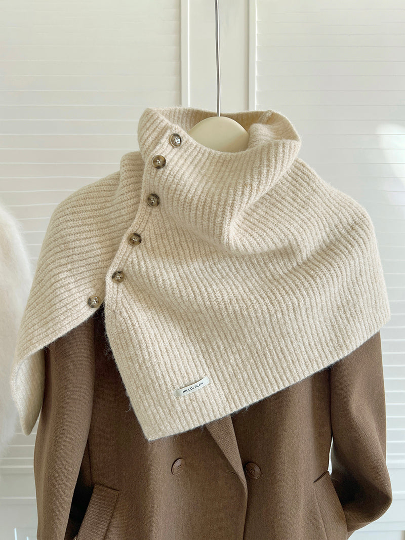 Women's High Neck Buttoned Knit Cape Shawl — beige buttoned cape shawl shown on a hanger