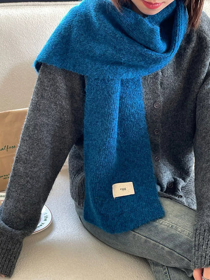 Unisex Fuzzy Solid Knit Scarf — blue textured scarf draped with both ends forward