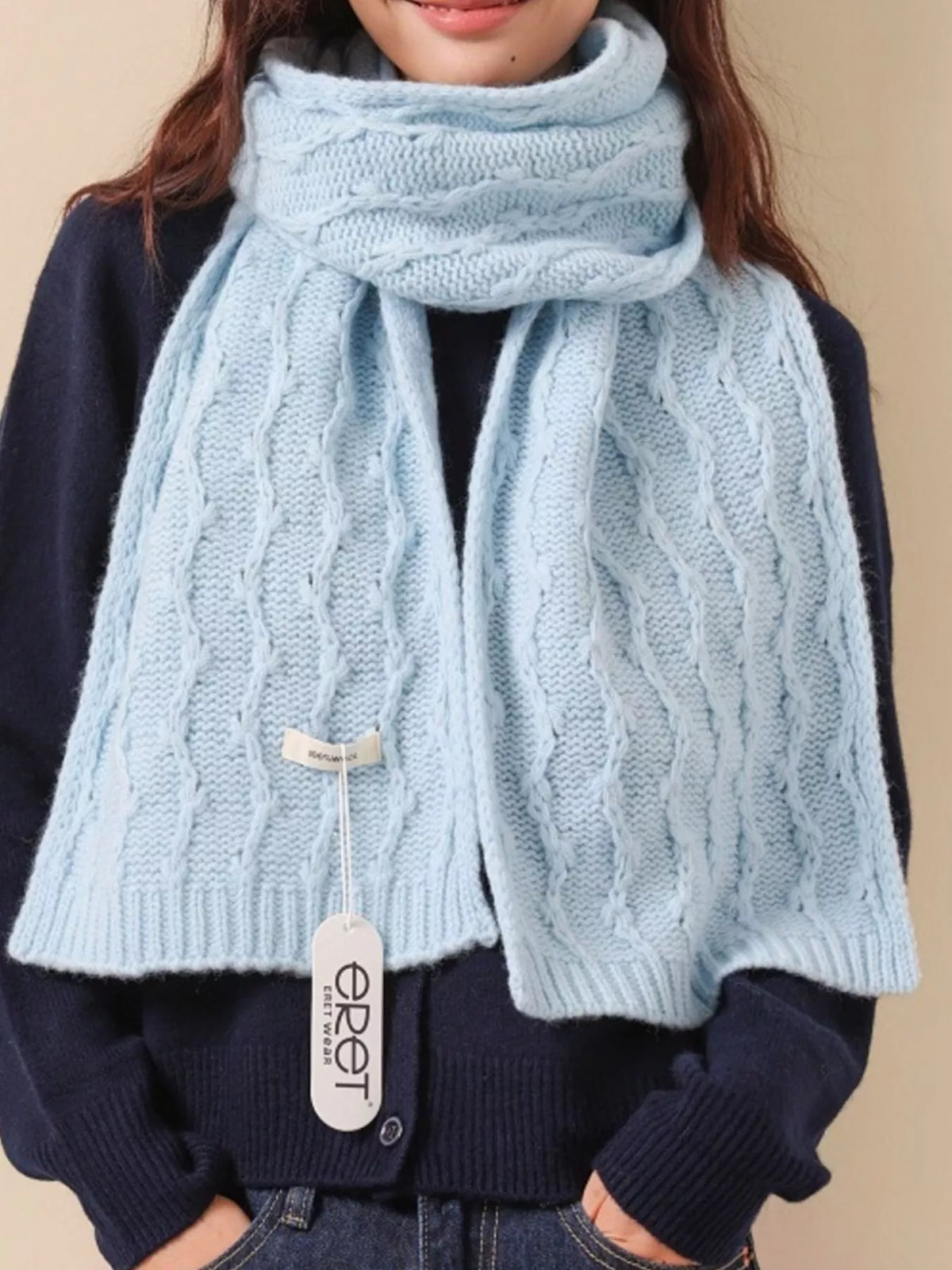 Unisex Wool Cozy Cable Knit Scarf — pale blue scarf draped over a dark jacket