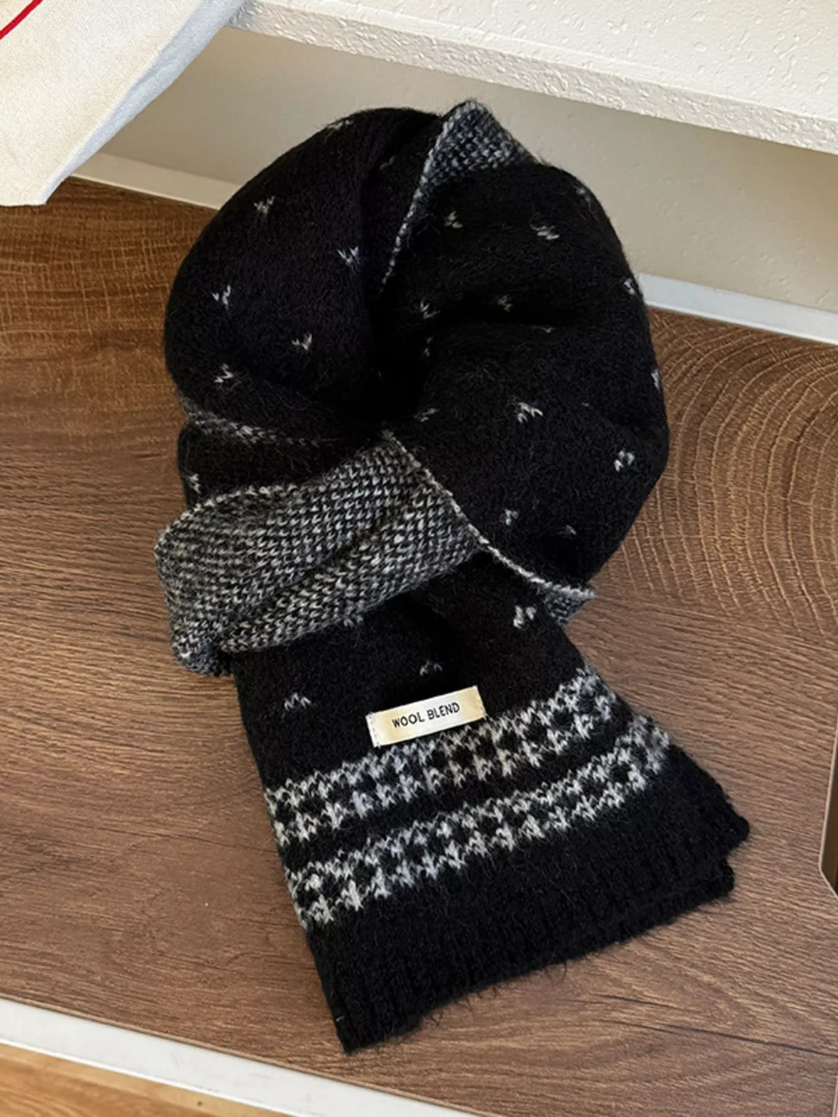 Unisex Flecked Border Knit Scarf — black scarf looped to show patterned end bands