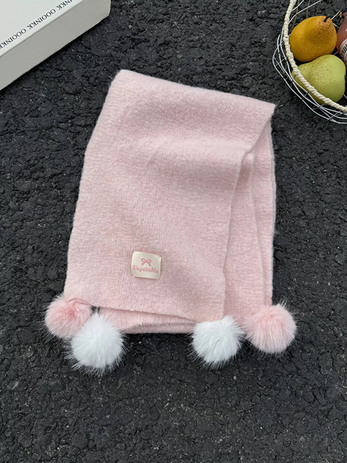 Unisex Pastel Pom-Pom Scarf — pink scarf folded with contrasting pom-poms visible