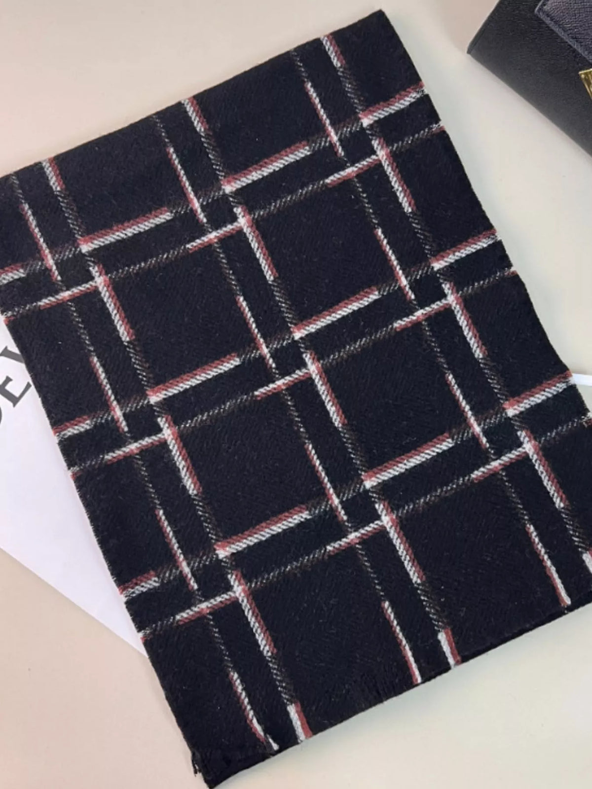 Unisex 100% Wool Raw Hem Plaid Scarf — flat view of dark plaid scarf with contrast grid