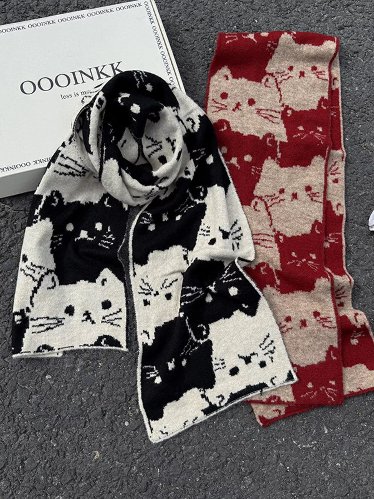 Unisex Allover Cat Knit Scarf — two contrasting cat scarves arranged in loose loops
