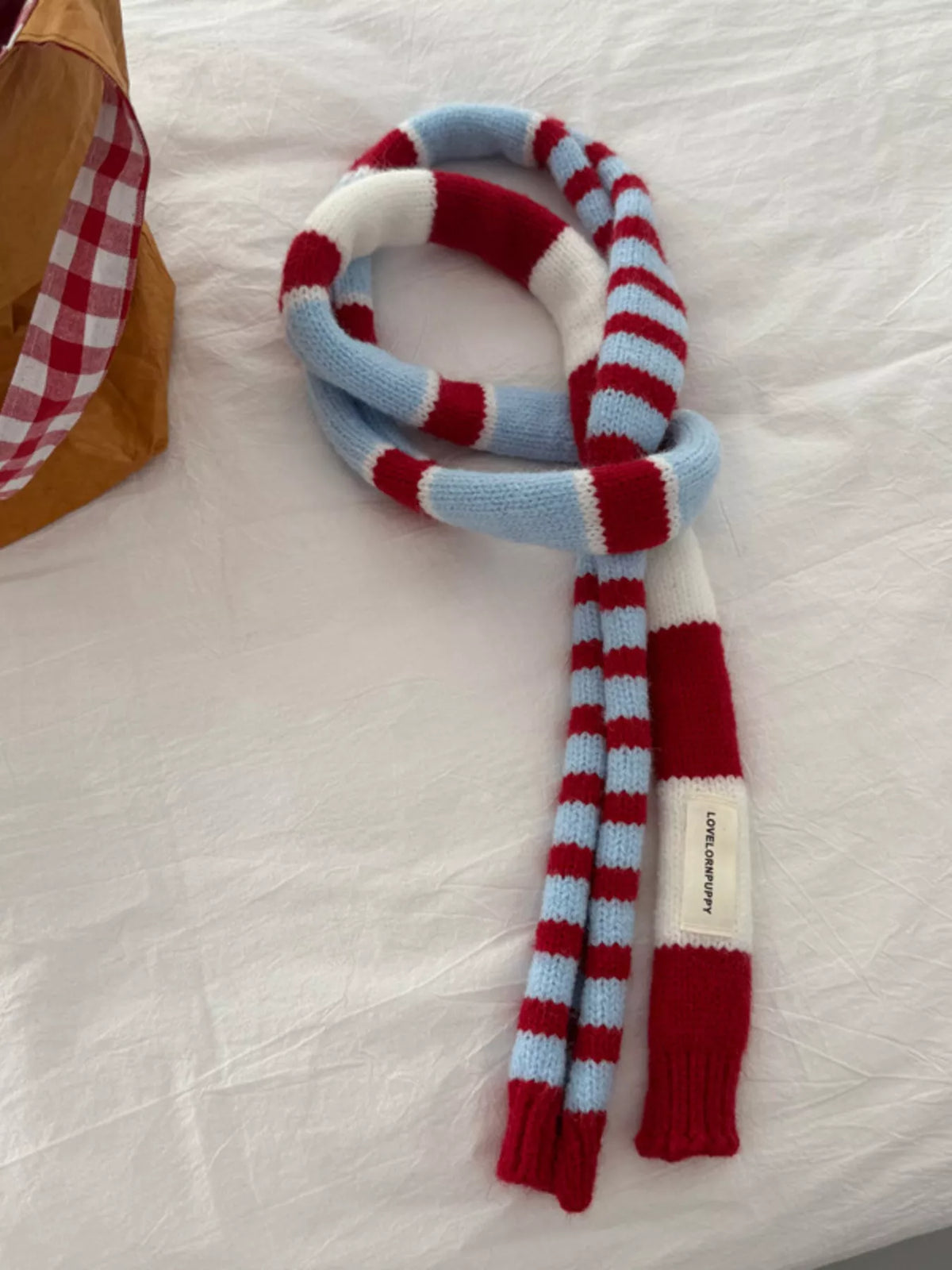 Unisex Red Stripe Skinny Scarf — slim red and pale striped scarf loosely looped