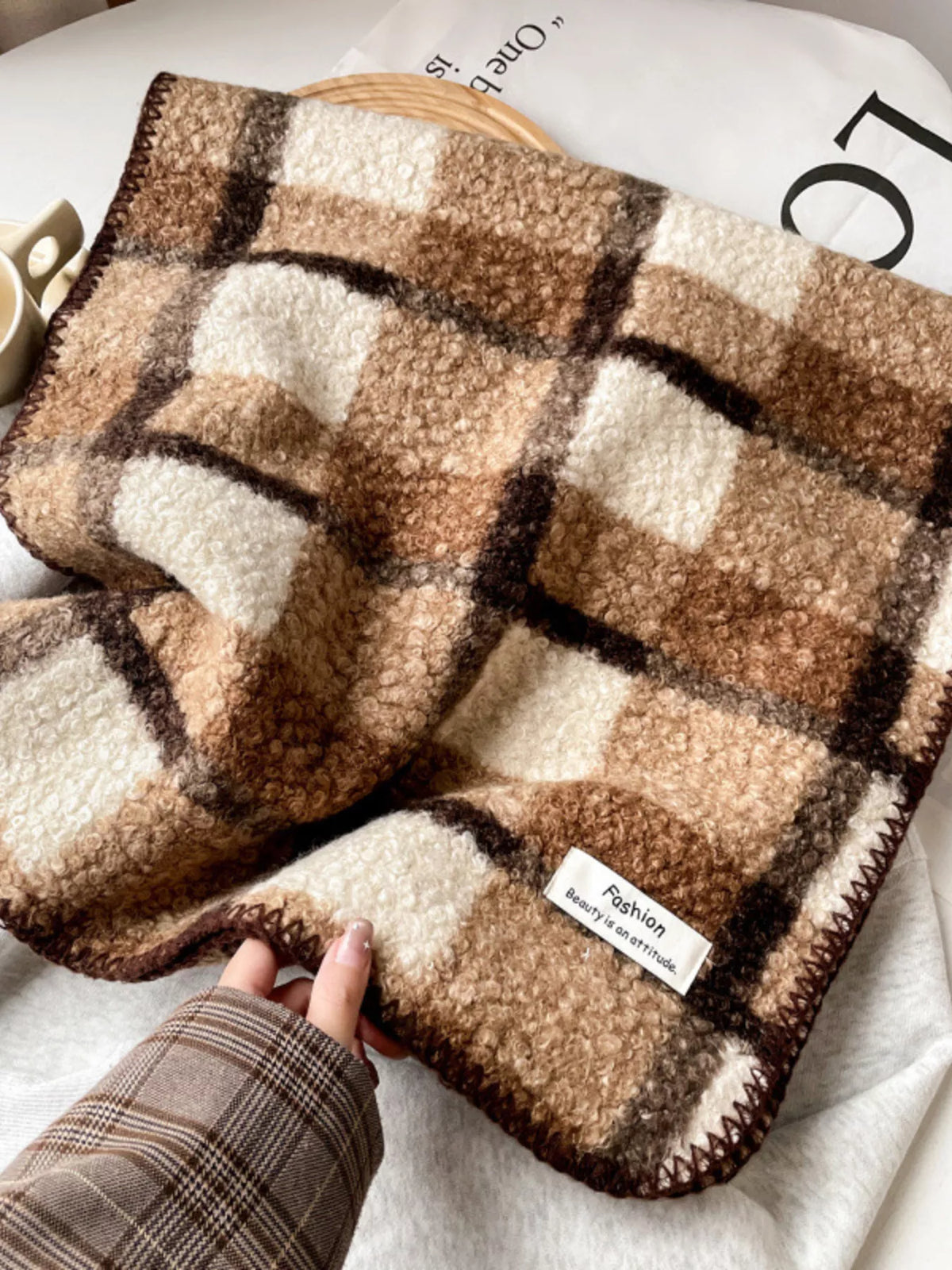 Unisex Textured Plaid Knit Scarf — folded brown checked scarf showing broad plaid bands