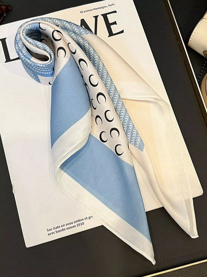 Unisex Printed Silk Square Scarf — blue silk scarf loosely tied with long pointed corners