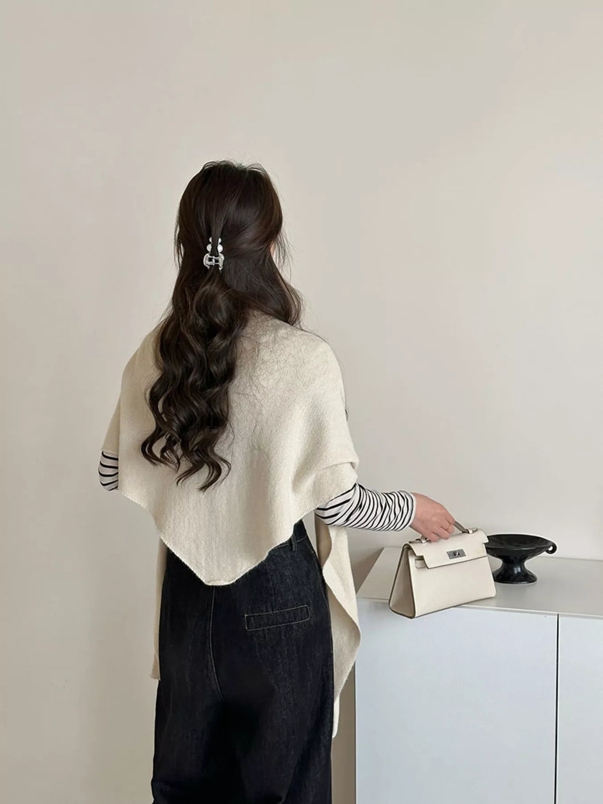 Women's Neutral Wool Shoulder Wrap — rear view of an off-white pointed shawl