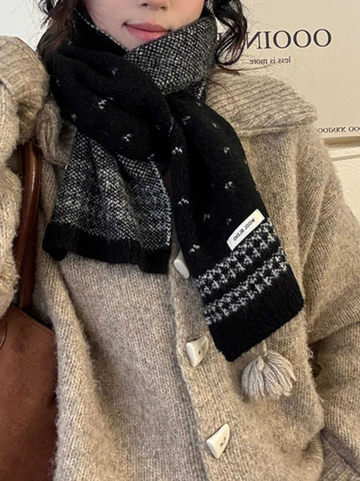 Unisex Flecked Border Knit Scarf — black flecked scarf worn over a pale coat