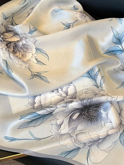 Unisex Floral Print Silk Square Scarf — close detail of outlined flower and blue edge