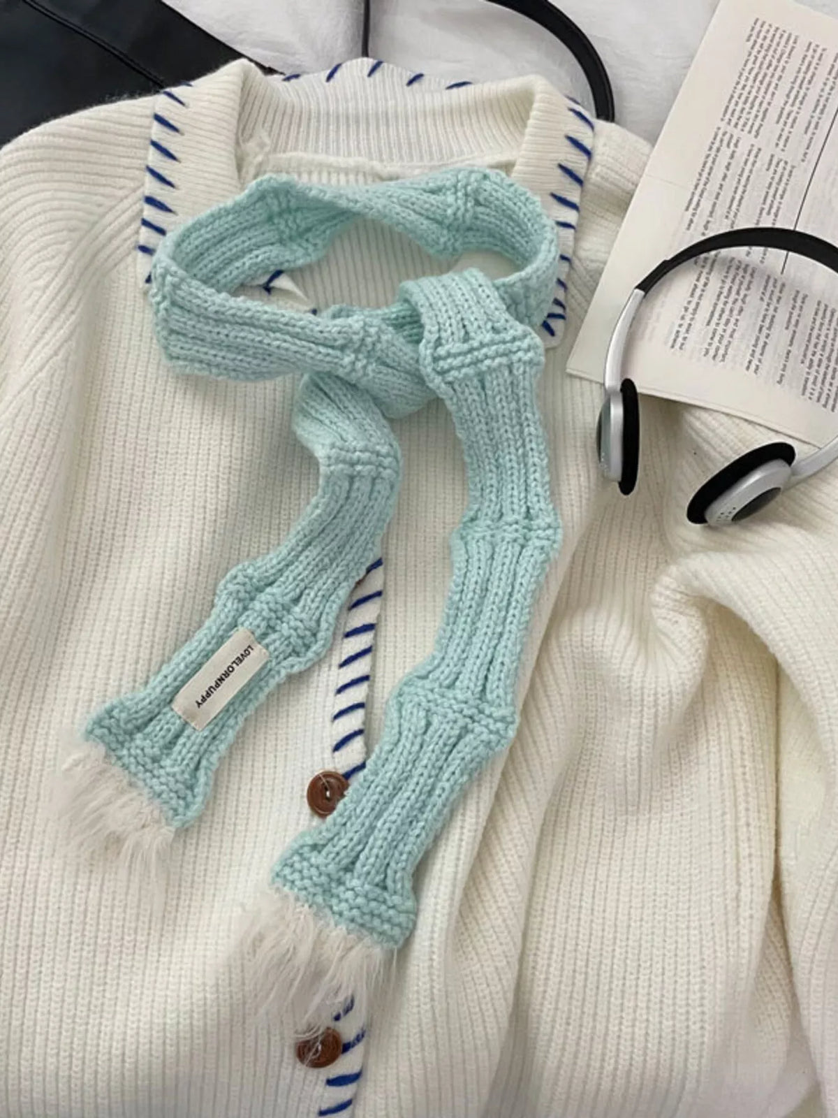 Unisex Plush-Tip Skinny Knit Scarf — mint scarf tied over a pale jacket