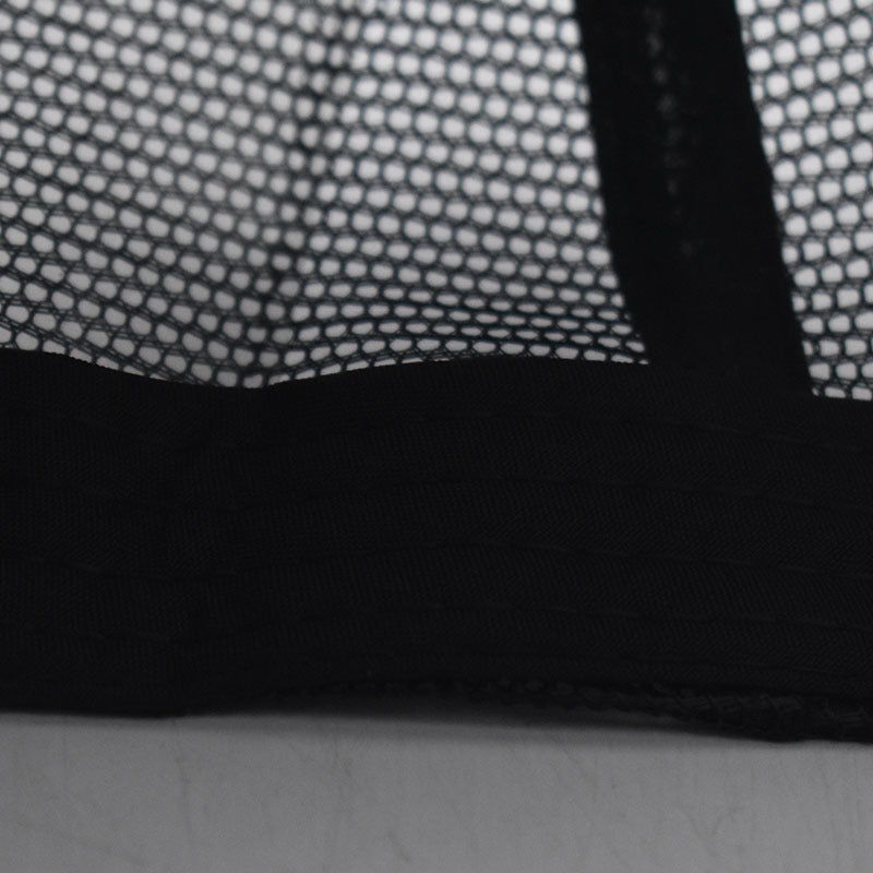 Close-up of black mesh fabric on Boston trucker cap