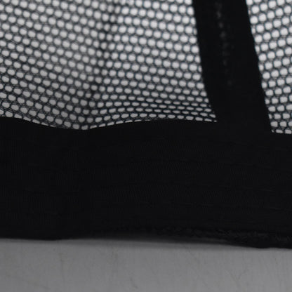 Close-up of black mesh fabric on Boston trucker cap
