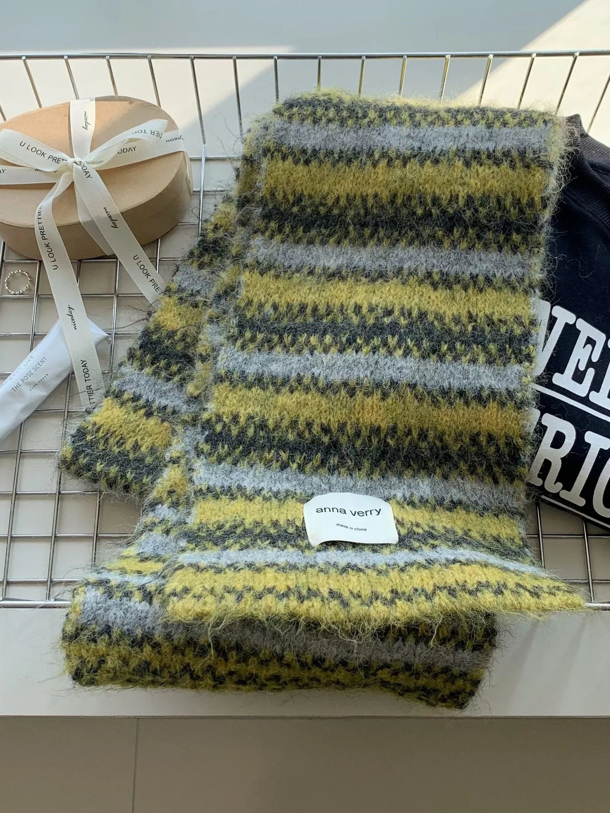 Unisex Striped Knitted Warm Scarf — moss striped scarf laid long on a grid surface