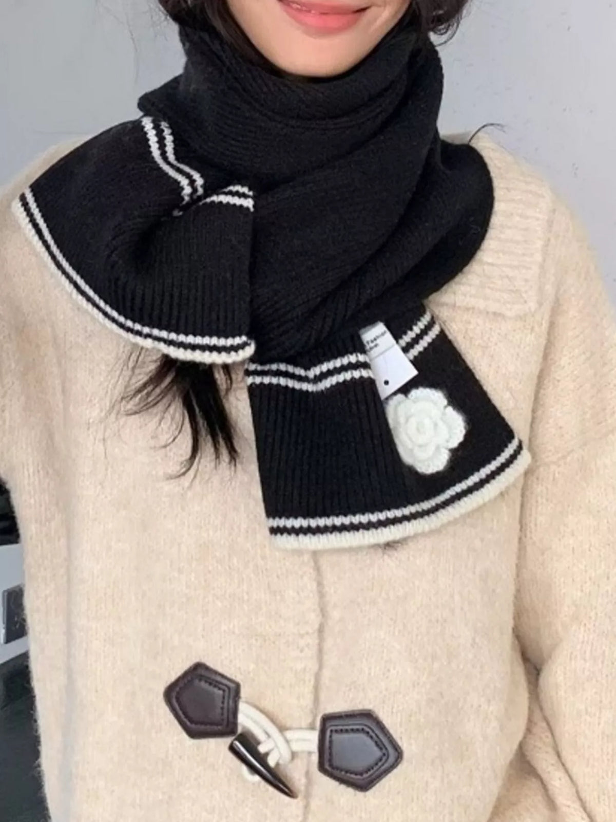 Women's Contrast Trim Knitted Scarf with Camellia Decor — short wrap styling showing both camellia decorated ends