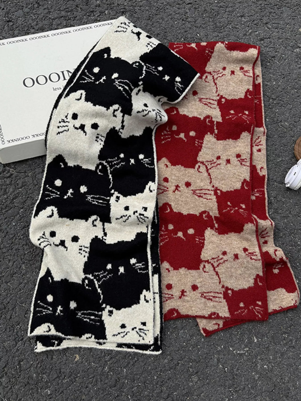 Unisex Allover Cat Knit Scarf — black and red cat patterned scarves displayed together