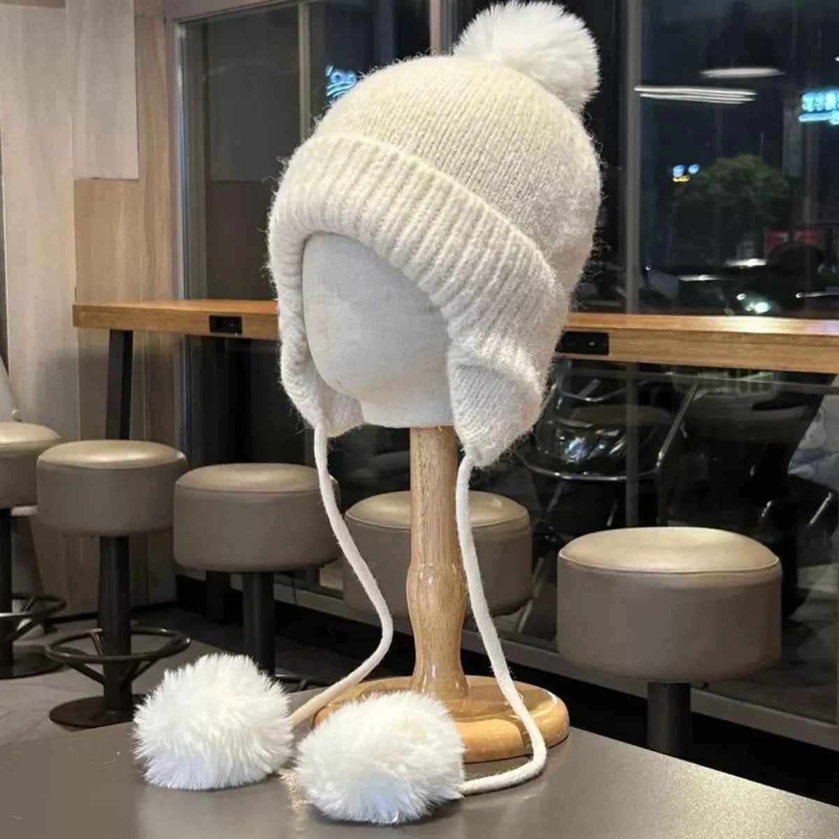 Soft polyester ear flap beanie pom pom detail