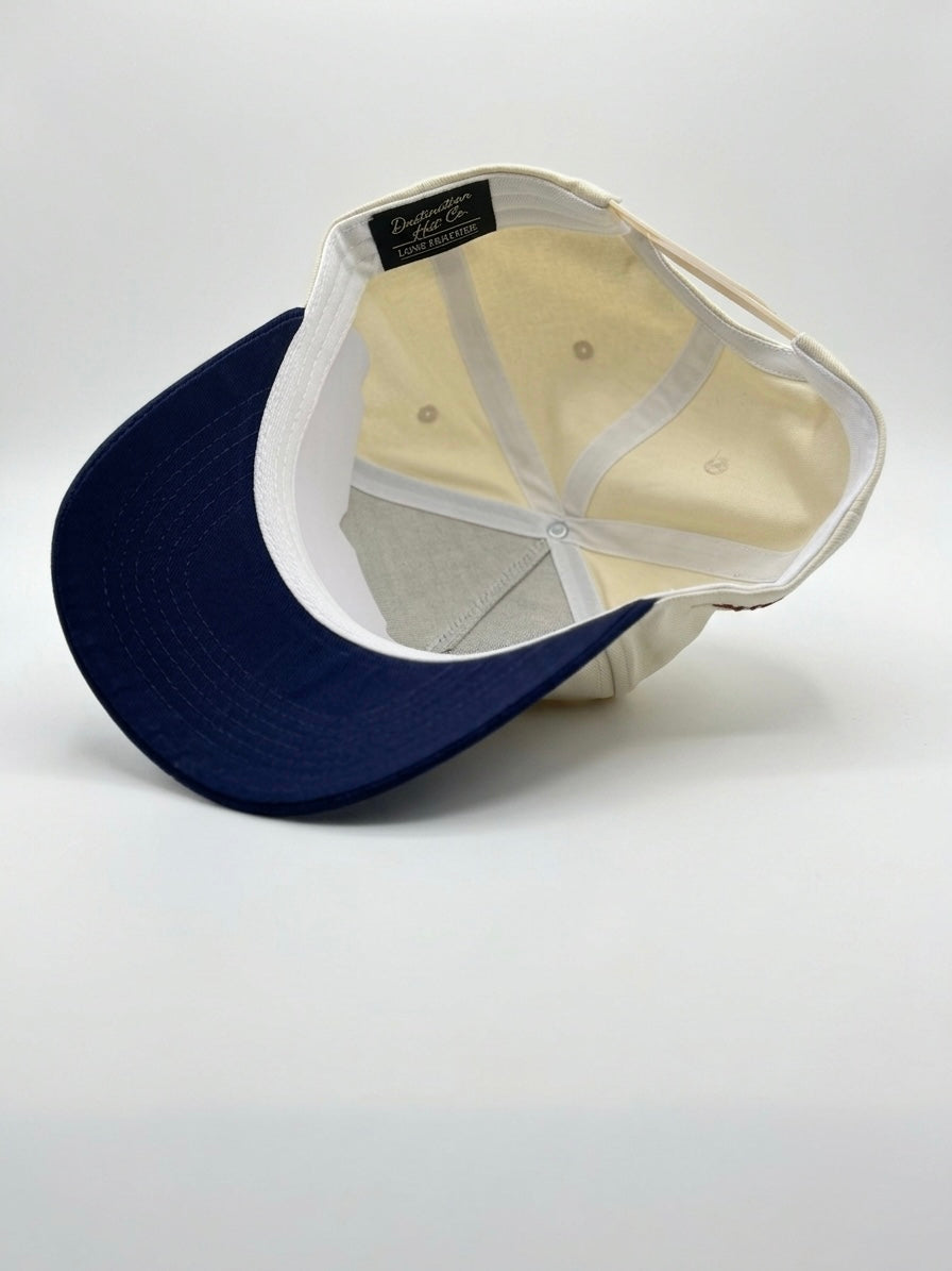 Interior view of the Destination Hat Co. U.S.A. script cap showing the inner band and underside of the bill
