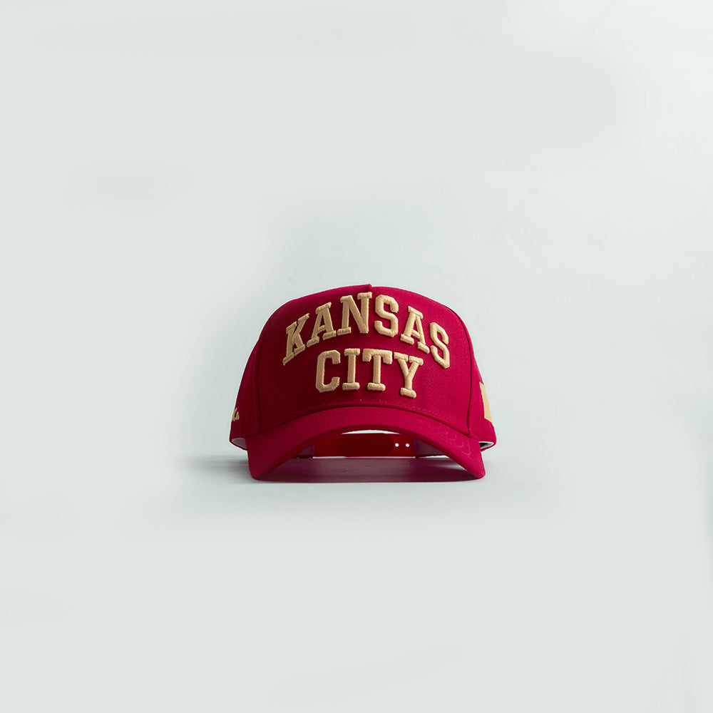 Front view of the Destination Hat Co. Kansas City Legacy snapback with yellow embroidery