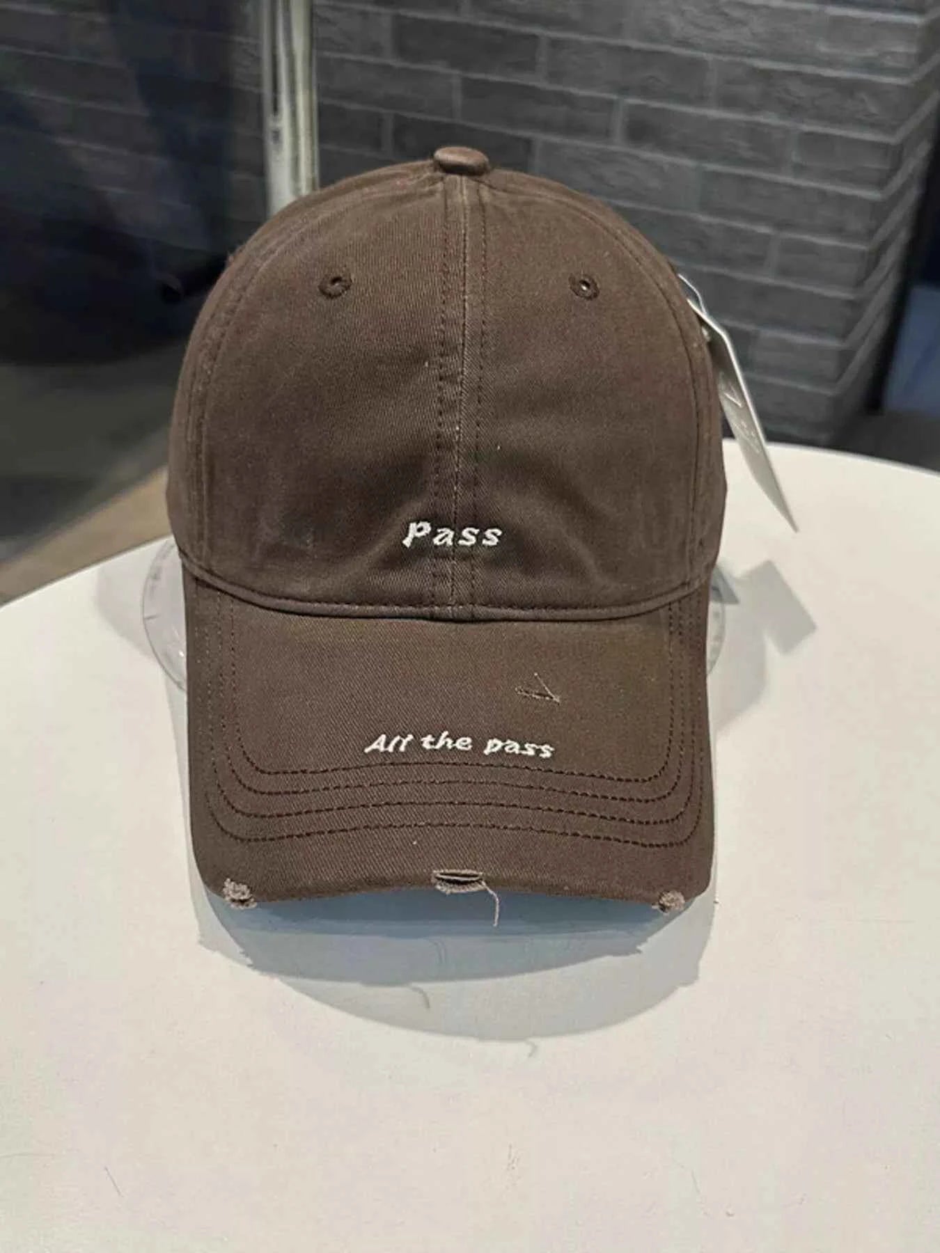 Black distressed embroidered baseball cap side view