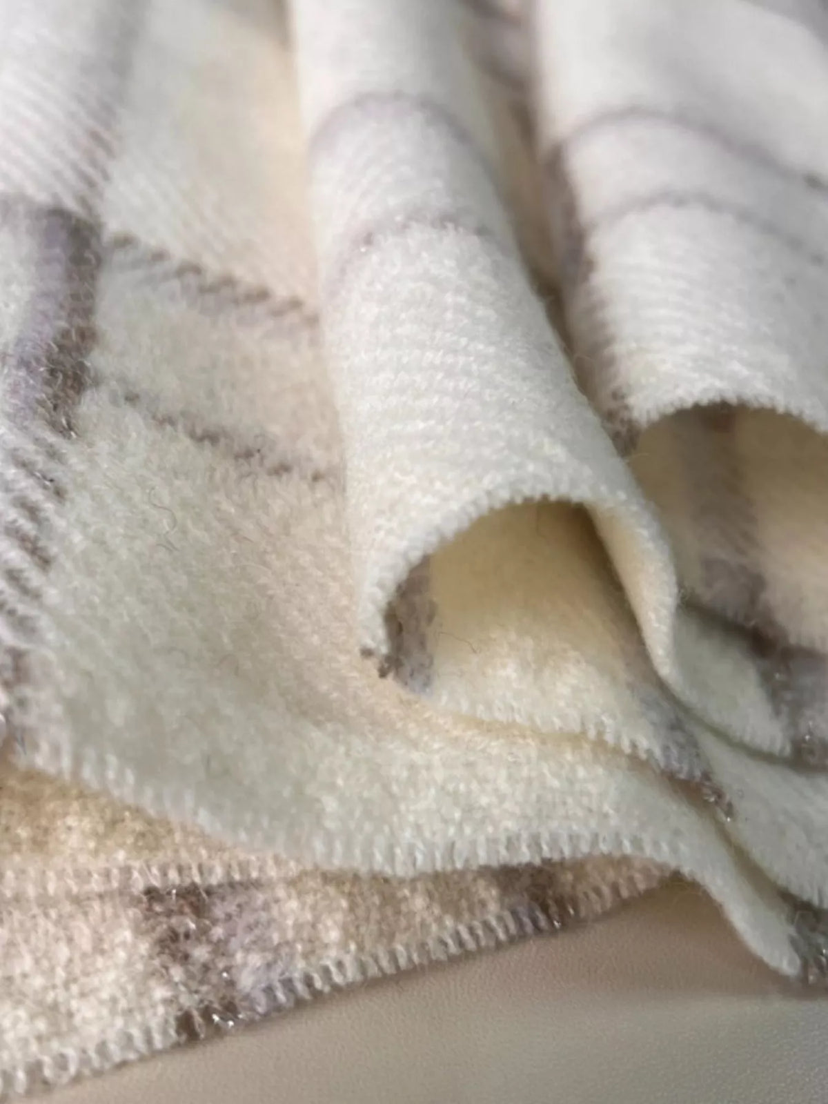 Unisex 100% Wool Raw Hem Plaid Scarf — close view of ivory scarf surface and softly fringed edge