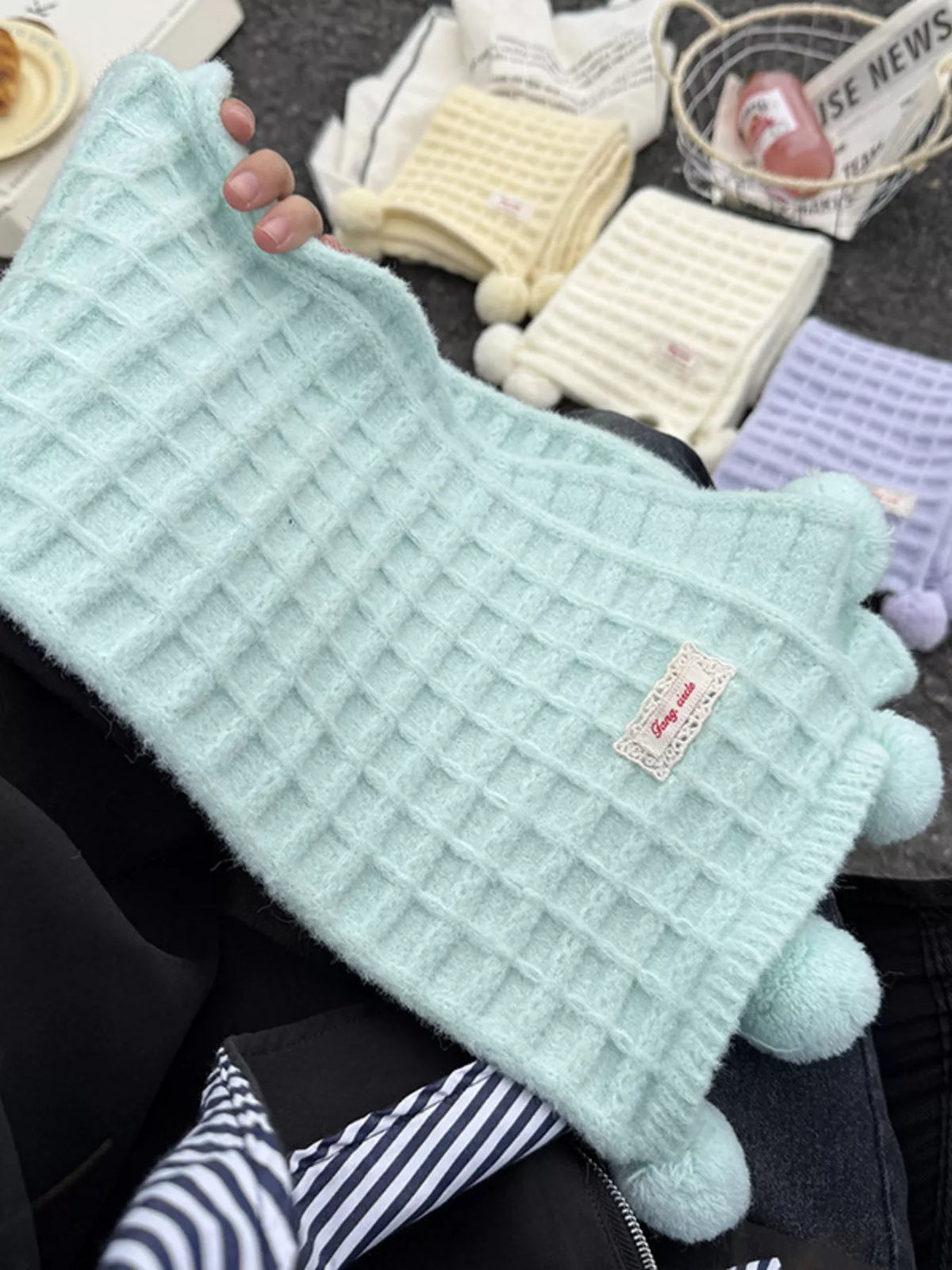 Unisex Pastel Waffle Knit Scarf — mint waffle scarf held to show texture and pom-poms