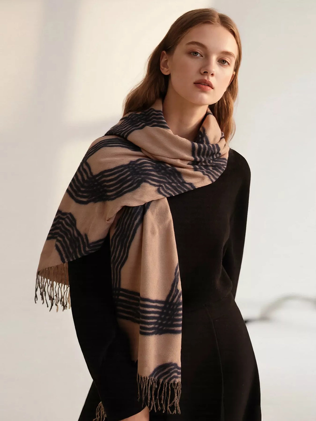Unisex Geometric Patterned Fringe Scarf — khaki patterned scarf wrapped across the shoulders