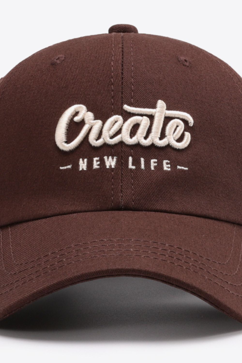 Navy CREATE NEW LIFE cap curved brim detail