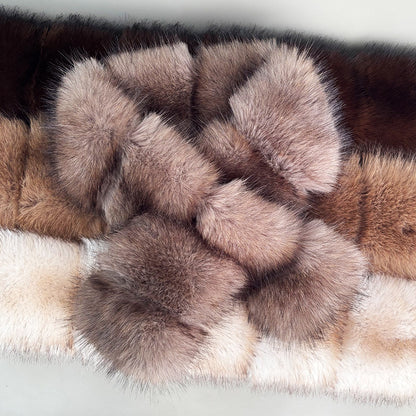 Close-up of taupe segmented faux fur scarf with crossed ends