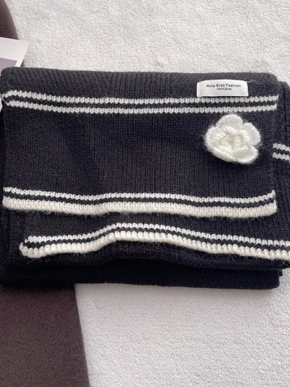 Women's Contrast Trim Knitted Scarf with Camellia Decor — folded scarf showing striped trim and pale flower detail