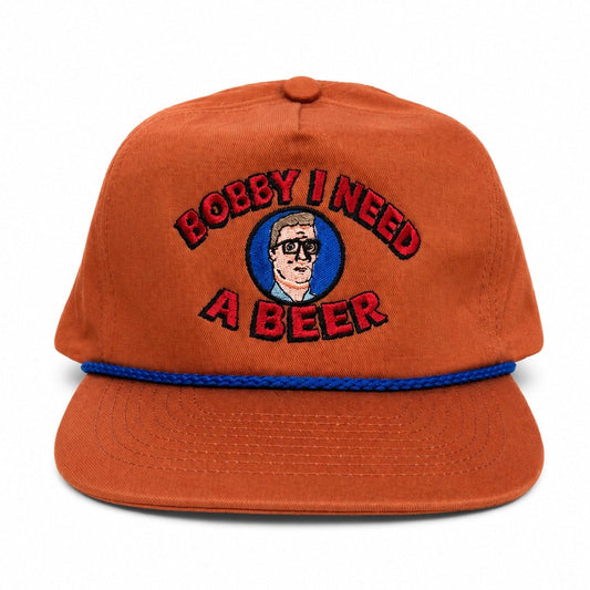 Old School Hats orange Bobby I Need cap with embroidered character, text, and blue rope