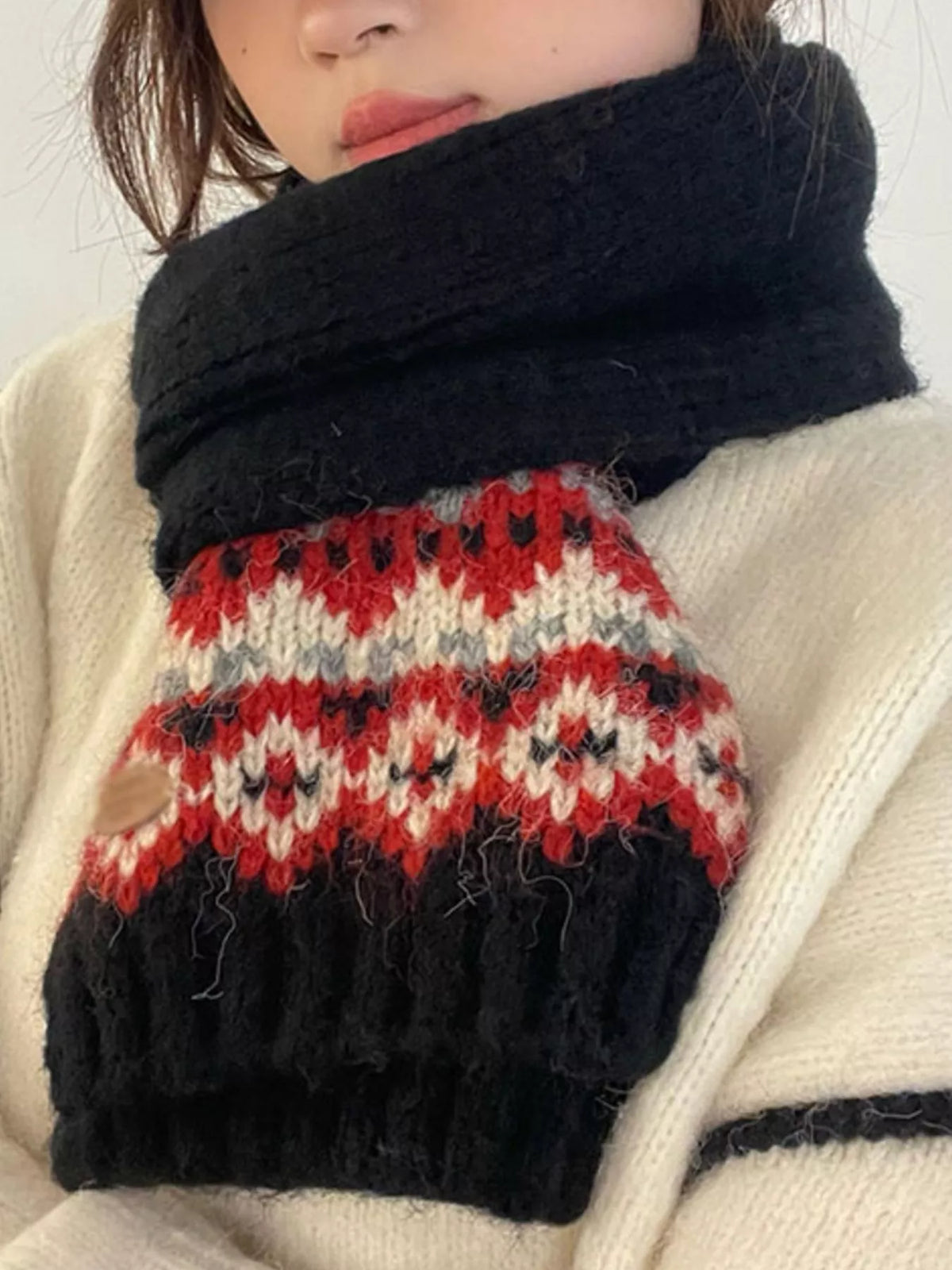 Unisex Nordic Motif Knit Scarf — closer neckline view of a dark patterned winter scarf