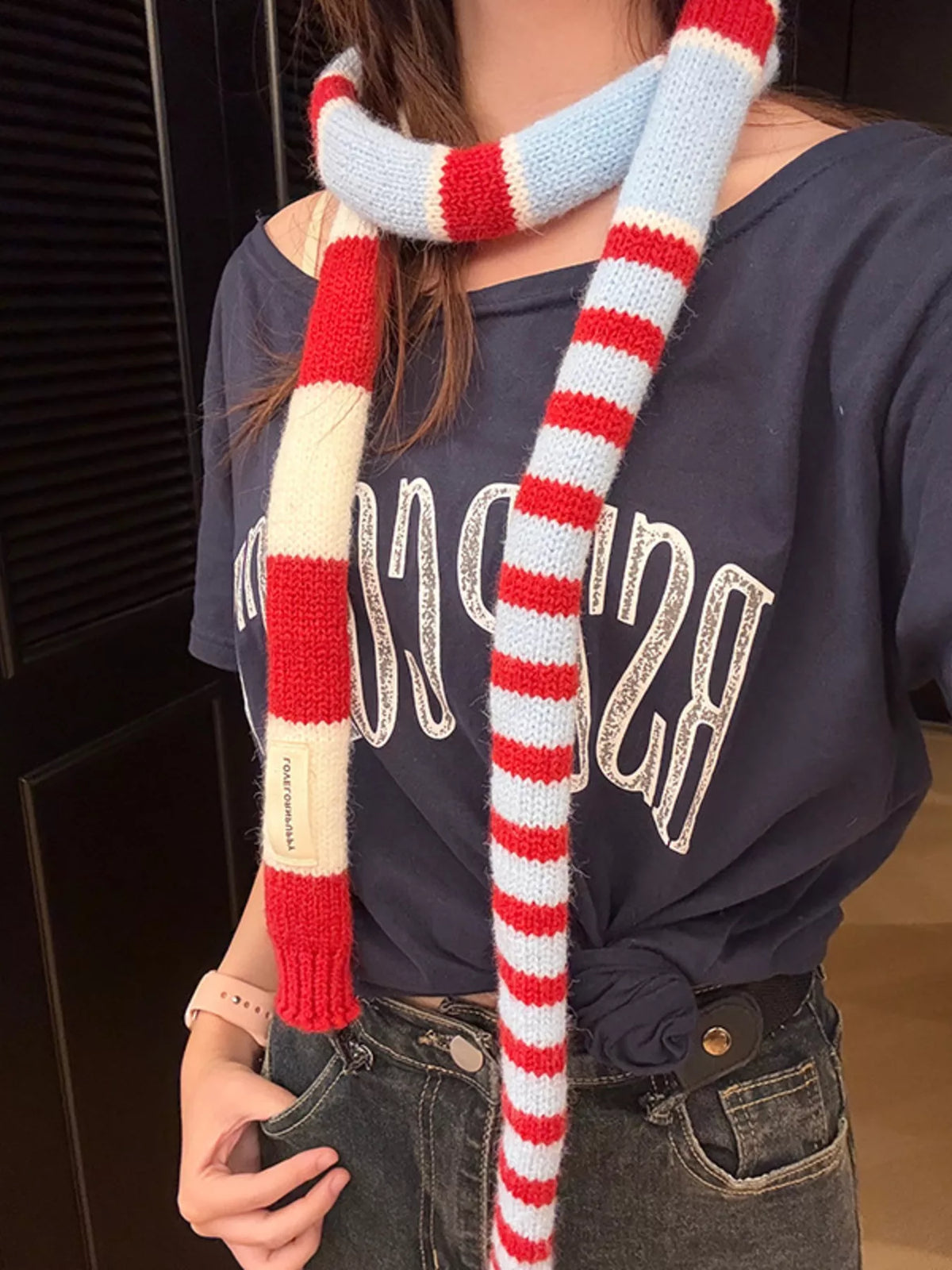 Unisex Red Stripe Skinny Scarf — closer outfit view of the long narrow striped scarf