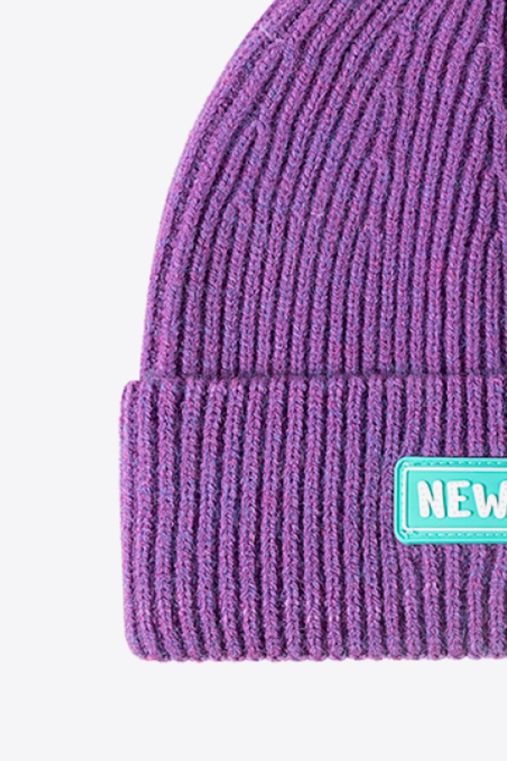 Black cuffed beanie clean studio side angle