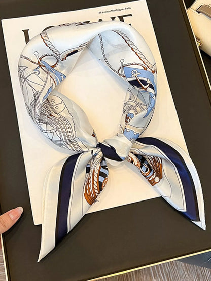 Unisex Nautical Print Silk Square Scarf — nautical silk scarf tied to show pale center and dark border