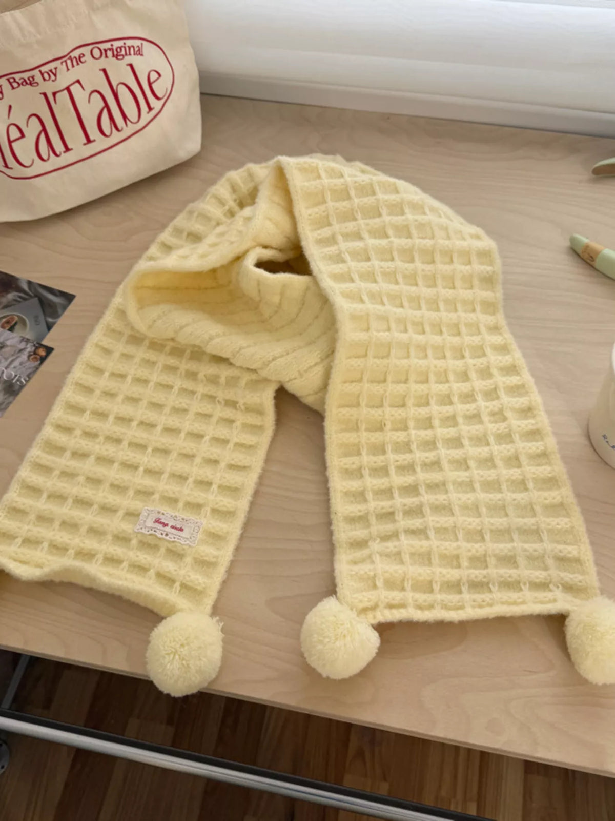 Unisex Pastel Waffle Knit Scarf — creamy yellow waffle scarf looped on a pale surface