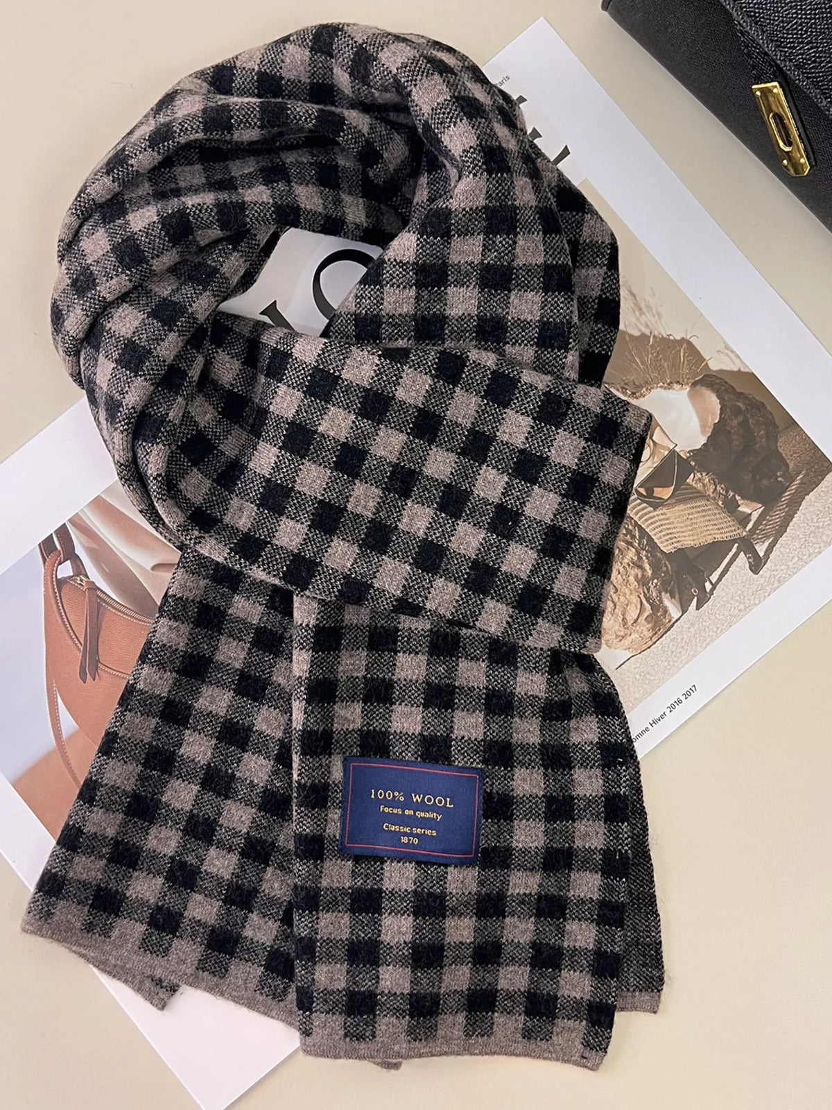 Unisex 100% Wool Plaid Scarf — dark gray checked scarf arranged on printed pages