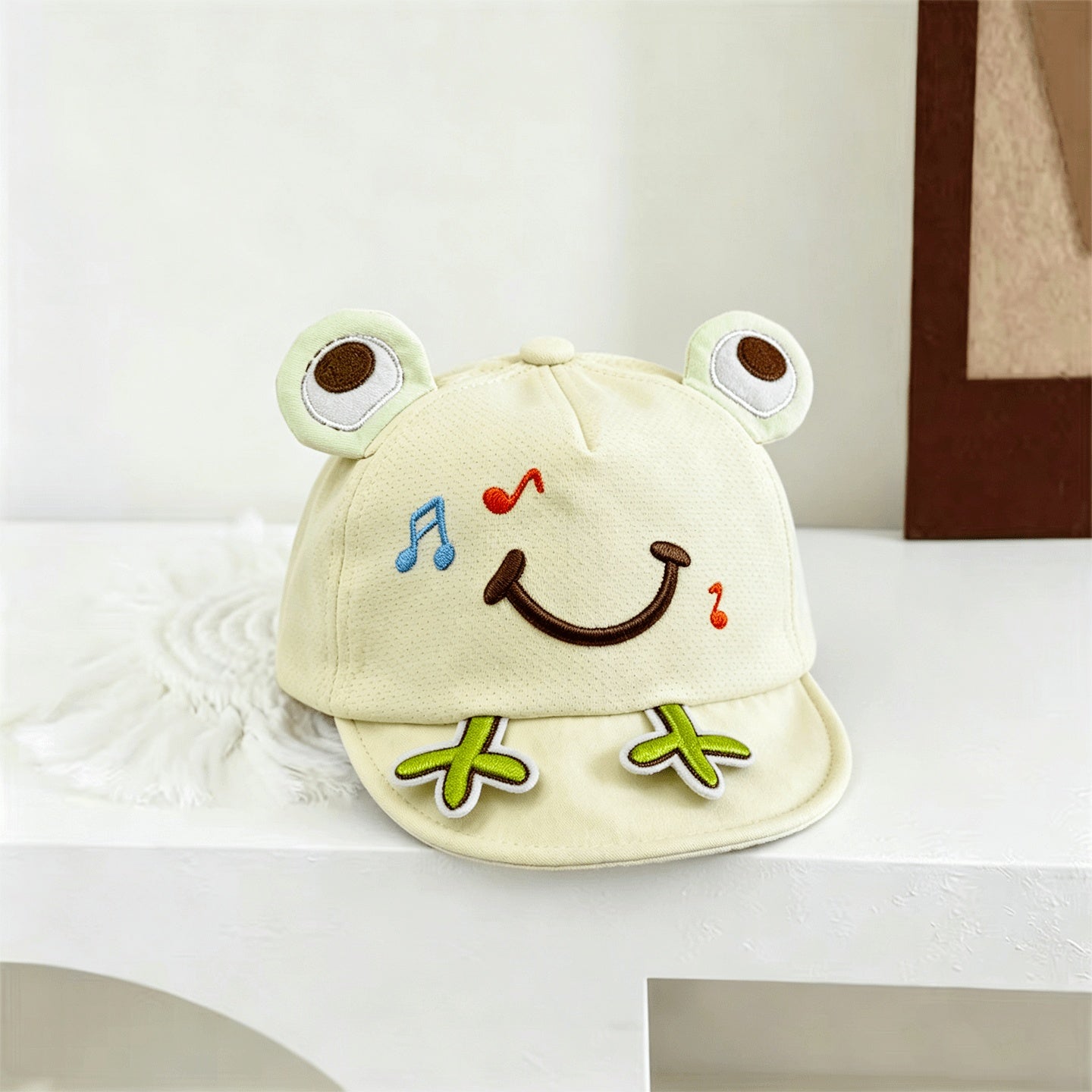 Blue toddler frog-ear cap side profile