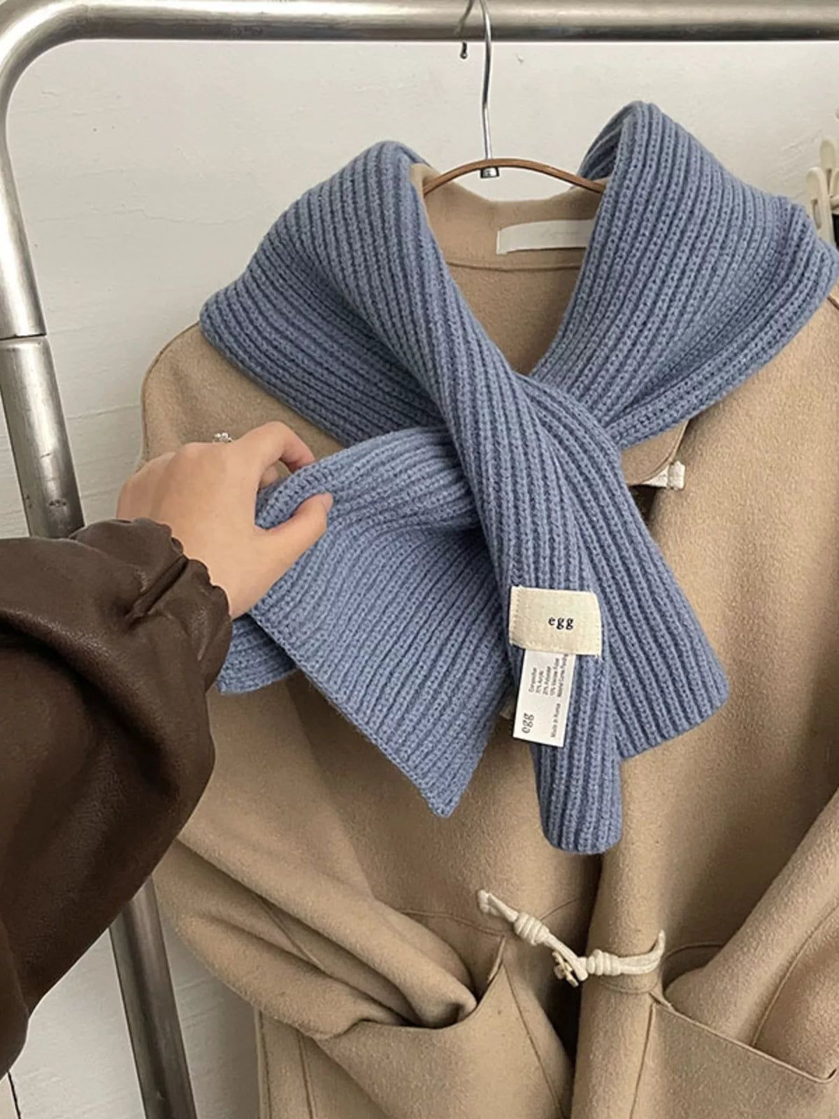 Unisex Compact Ribbed Knit Scarf — haze blue compact ribbed scarf crossed over a coat