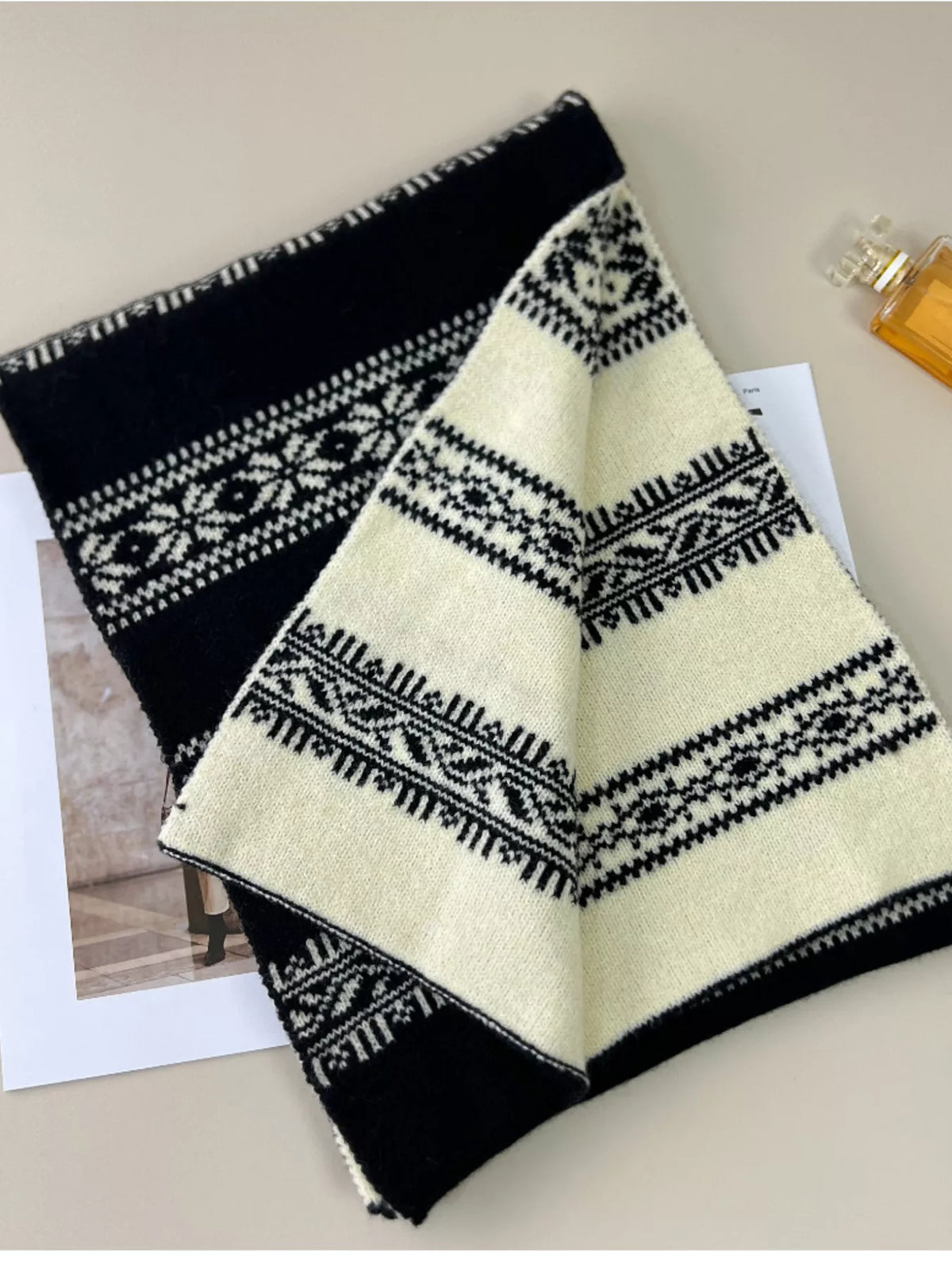 Unisex Winter Snowflake Pattern Knitted Scarf — black and cream scarf folded with reverse pattern showing