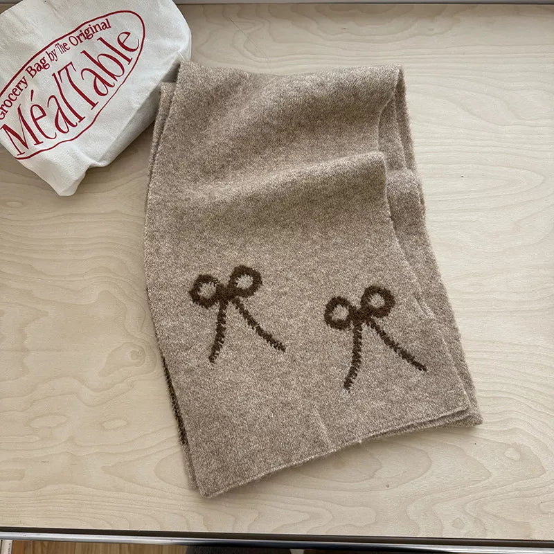 Unisex Bow Detail Knit Scarf — khaki scarf folded with dark bows visible