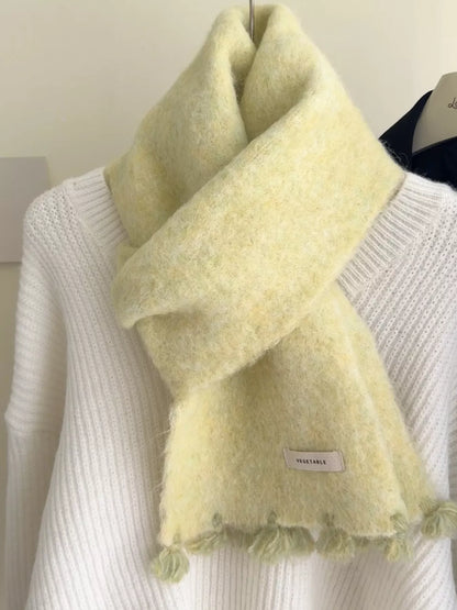 Unisex Tassel Knitted Scarf — close view of a pale yellow wool scarf at the neckline