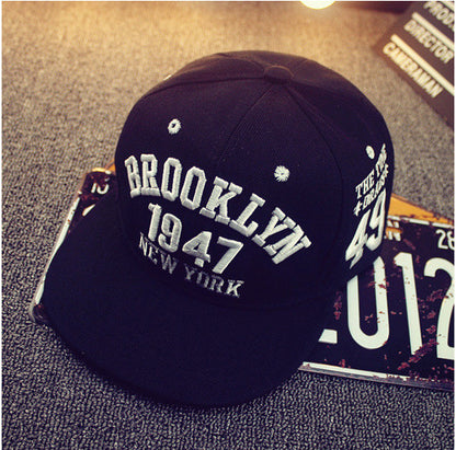 Adjustable flat-brim snapback rear closure