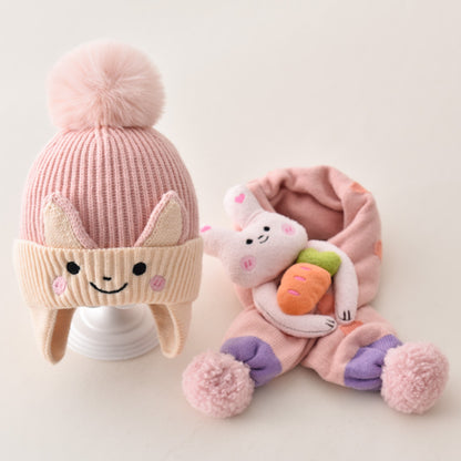 Pink animal earflap beanie and matching scarf with character details