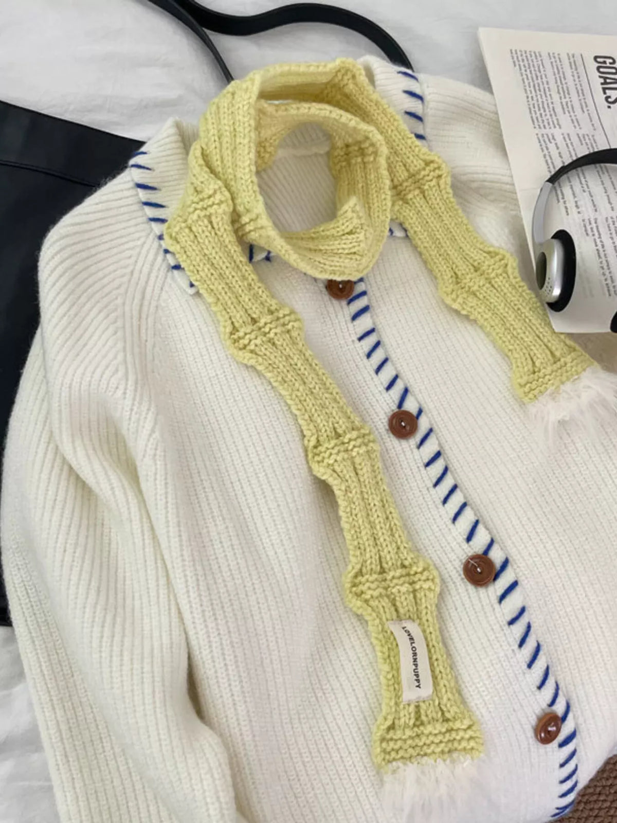 Unisex Plush-Tip Skinny Knit Scarf — yellow slim scarf tied over a light sweater