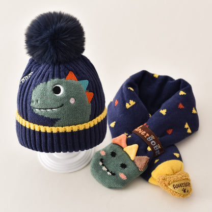 Navy dinosaur beanie with pom pom and coordinating patterned scarf