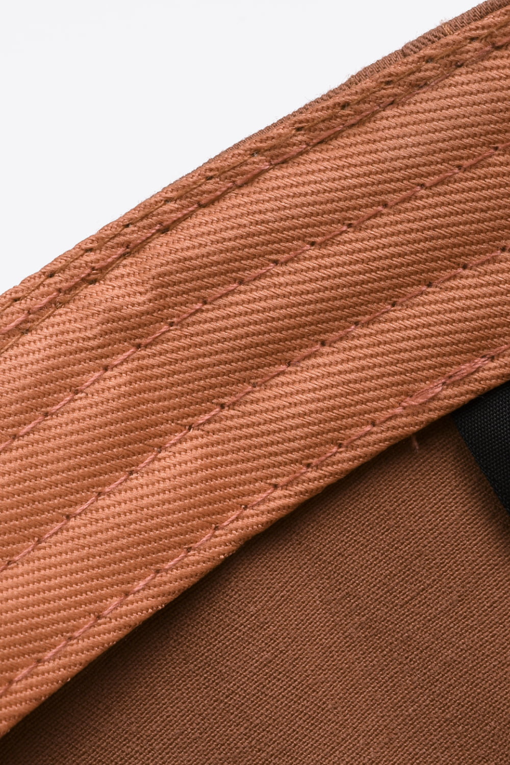 Distressed cap adjustable back strap detail